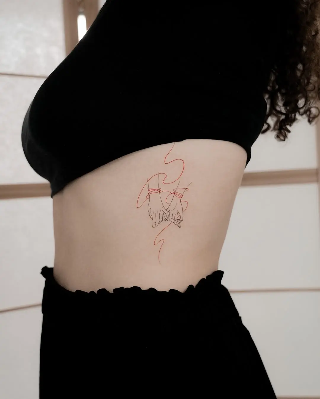 Elegant pinky promise tattoo on the side