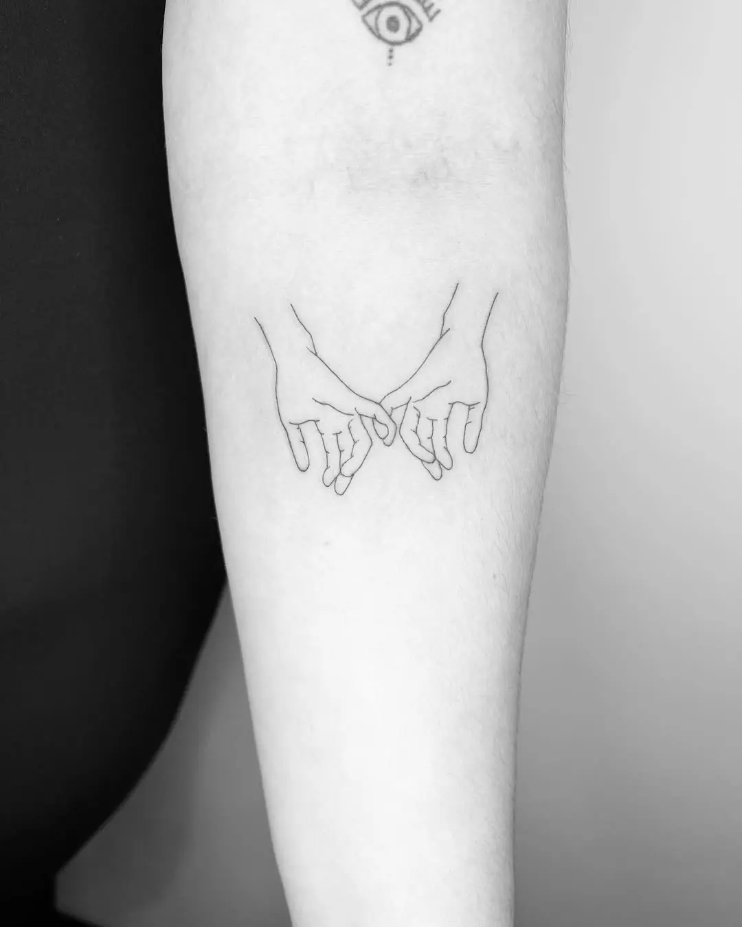Delicate pinky promise tattoo design