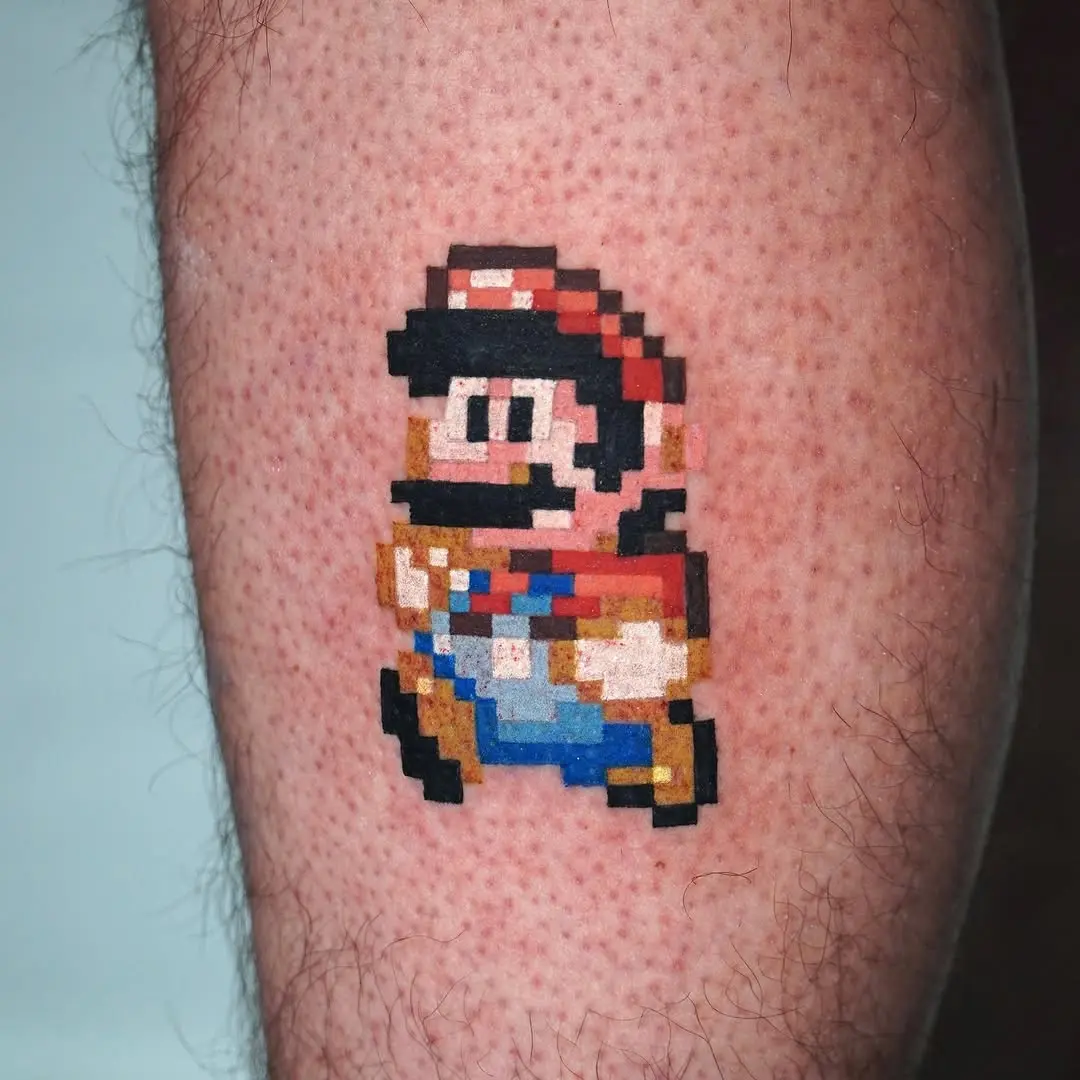Classic Mario pixel art tattoo on leg