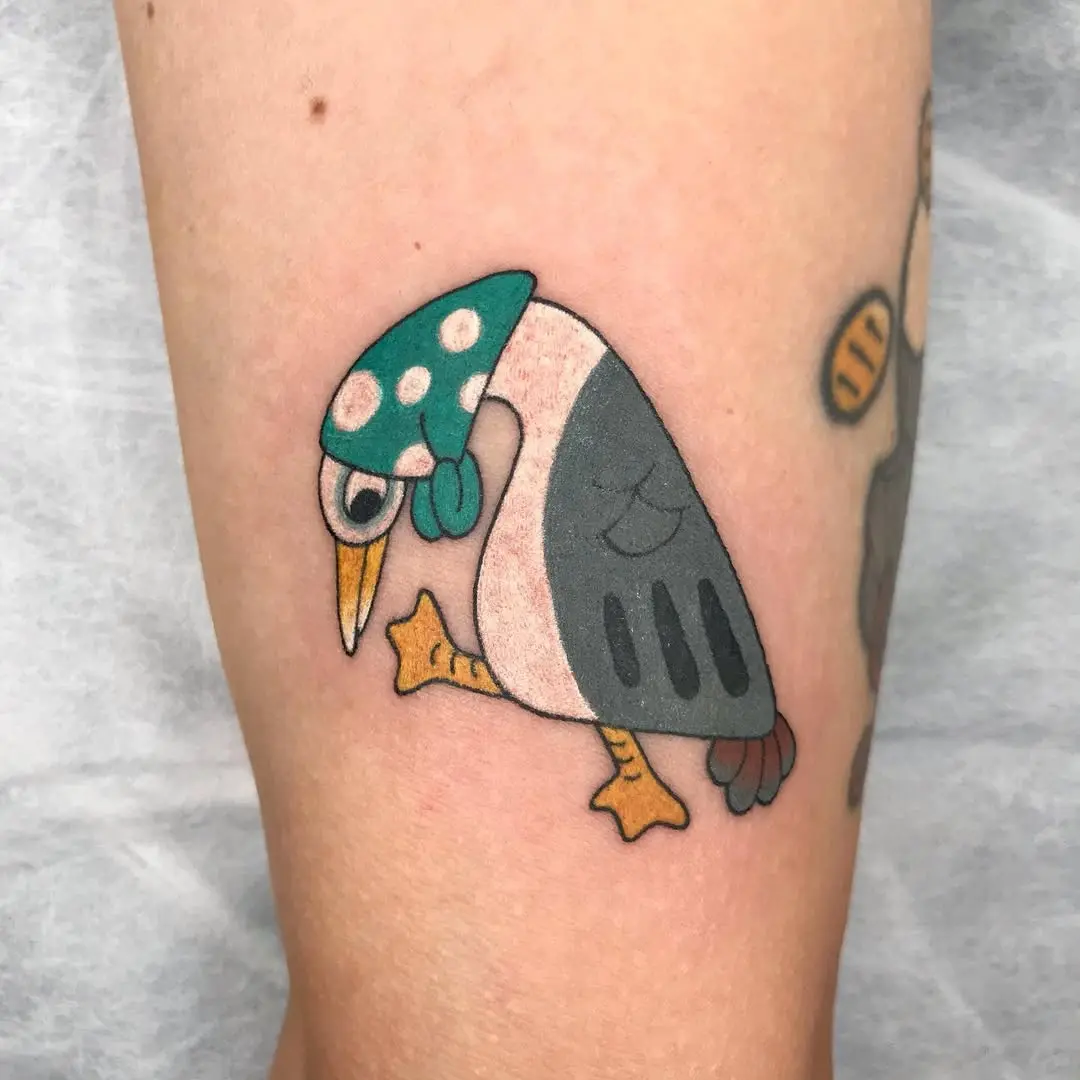 Playful seagull tattoo with vibrant colors
