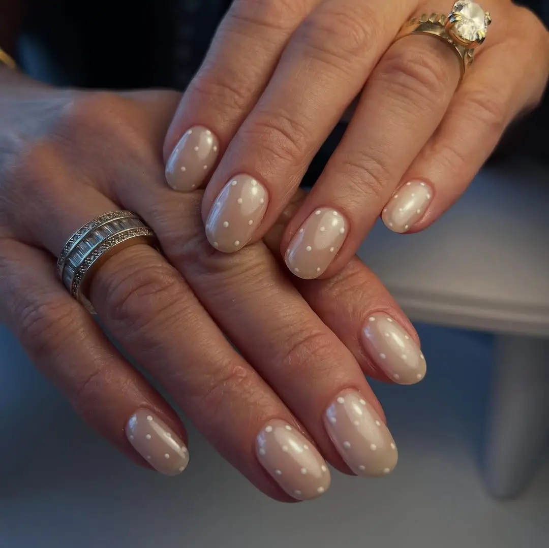 Chic beige polka dot nail art design