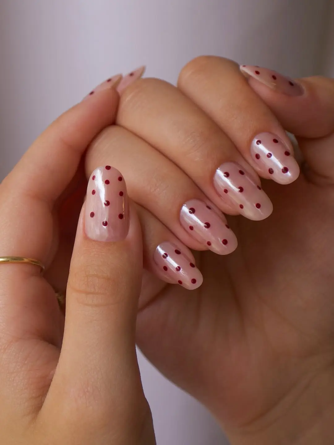 Chic polka dot nails on a nude base