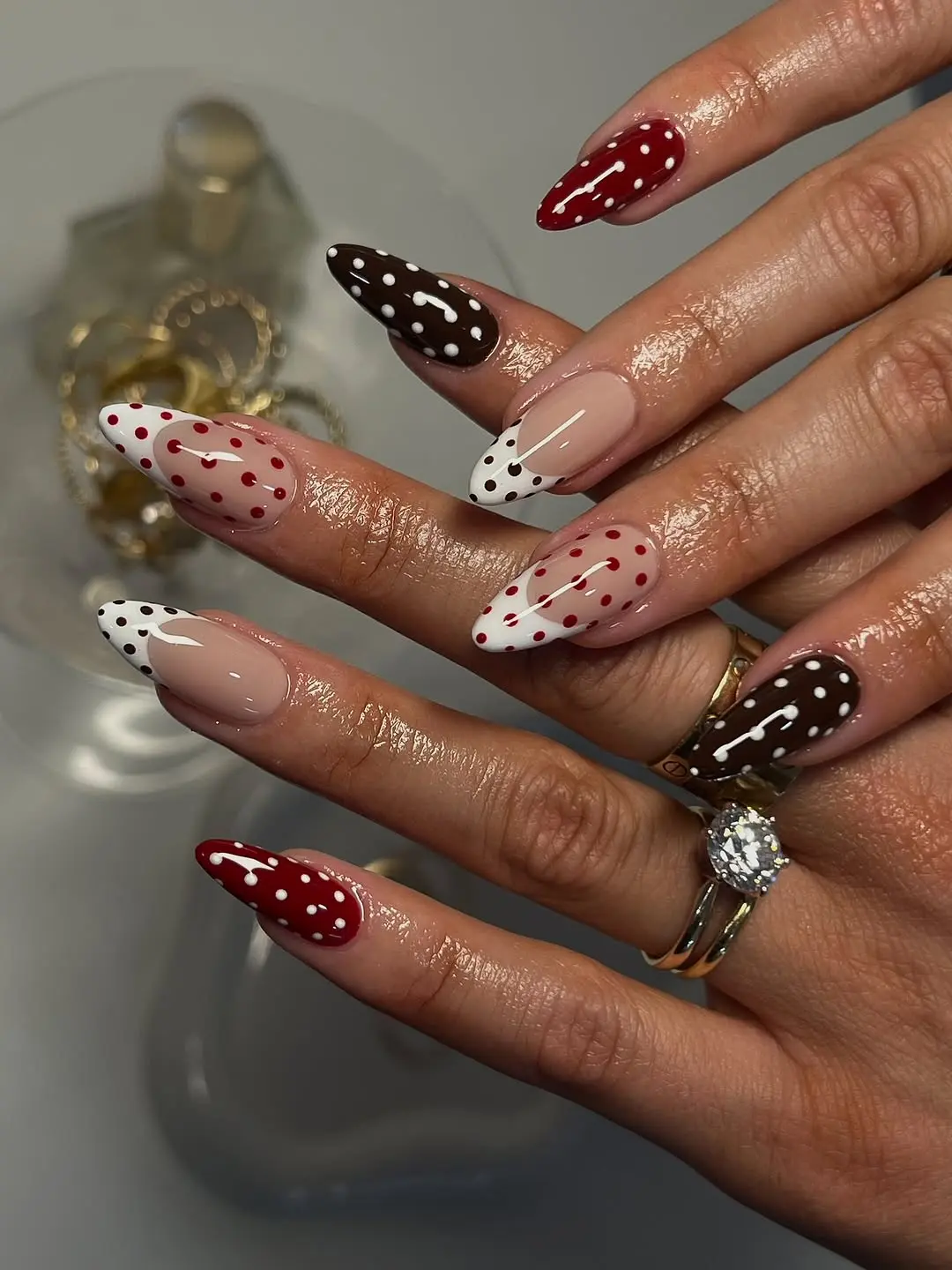 Playful polka dots on sharp almond nails