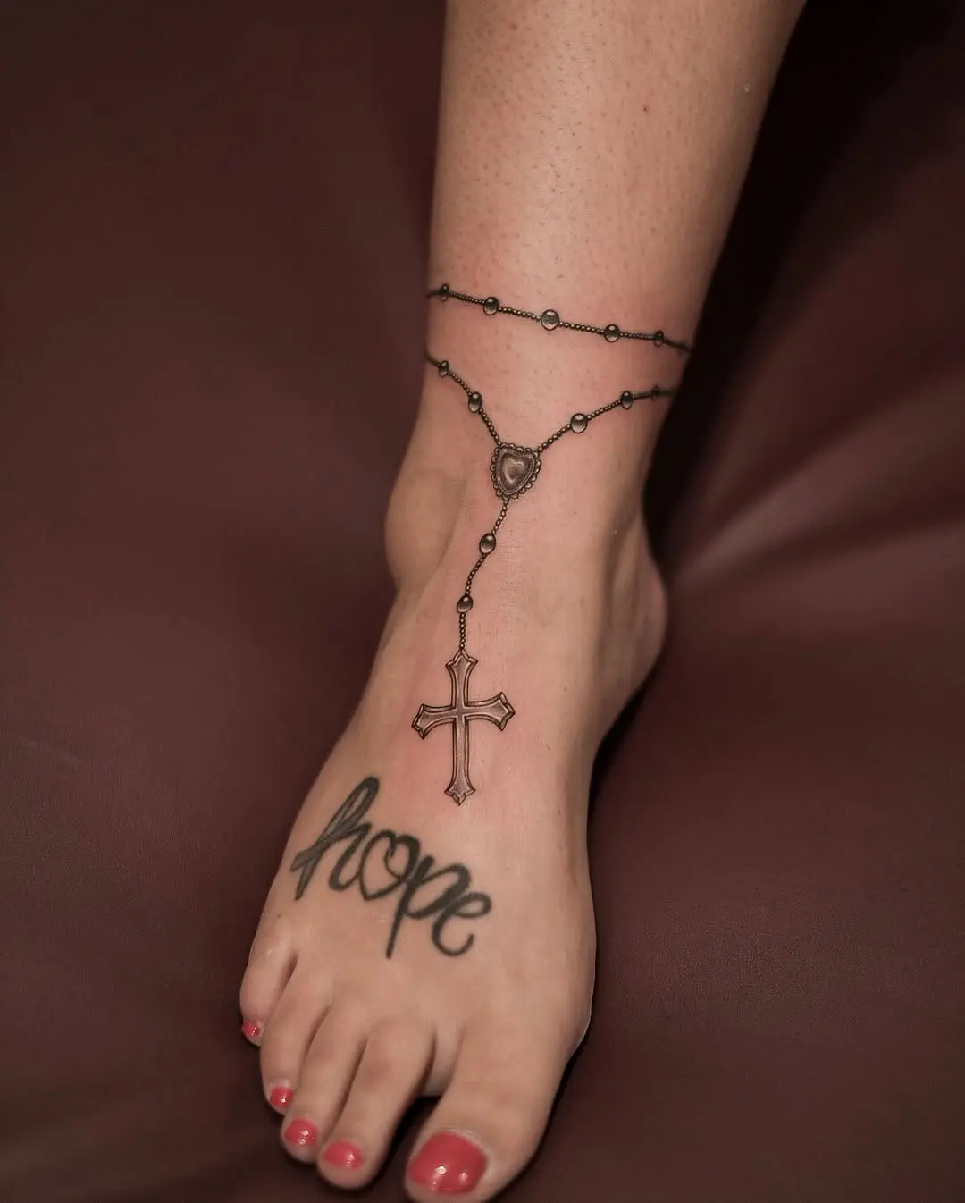 Elegant rosary tattoo with a hopeful message