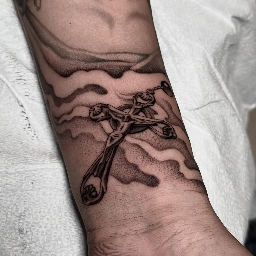 Elegant cross tattoo with intricate details