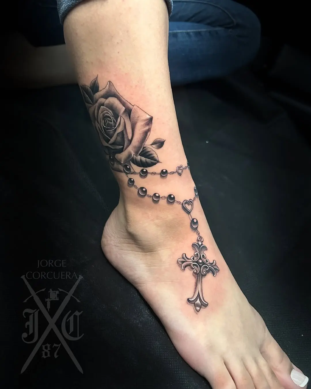 Elegant rosary tattoo with a floral touch