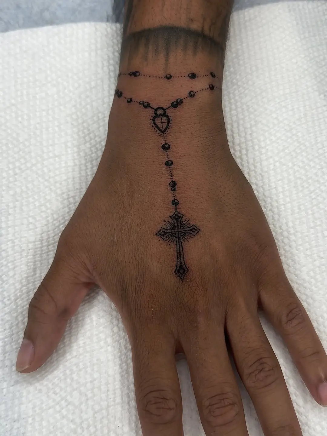 Elegant Rosary Tattoo on the Hand