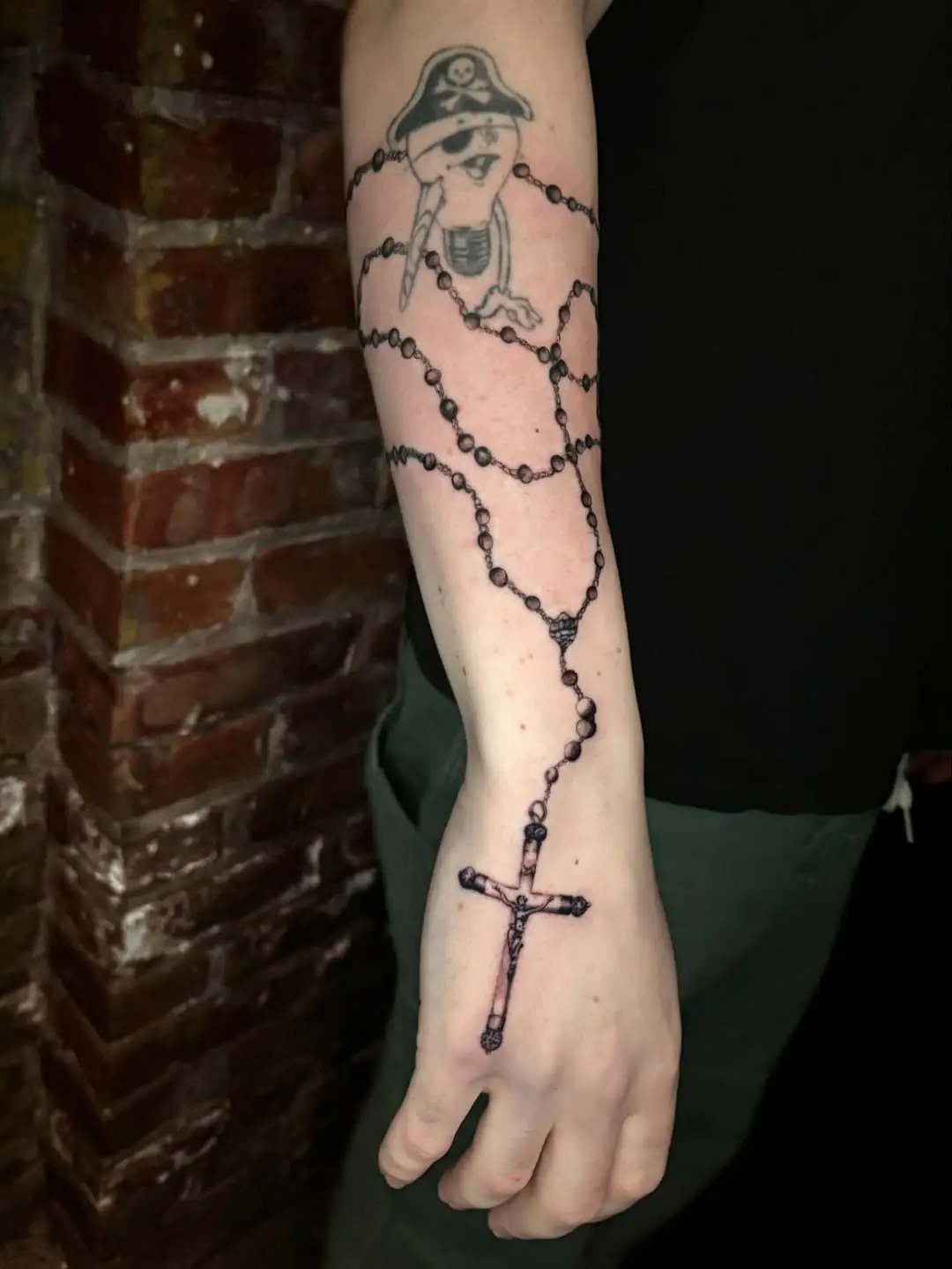 Unique Rosary Tattoo with Pirate Influence