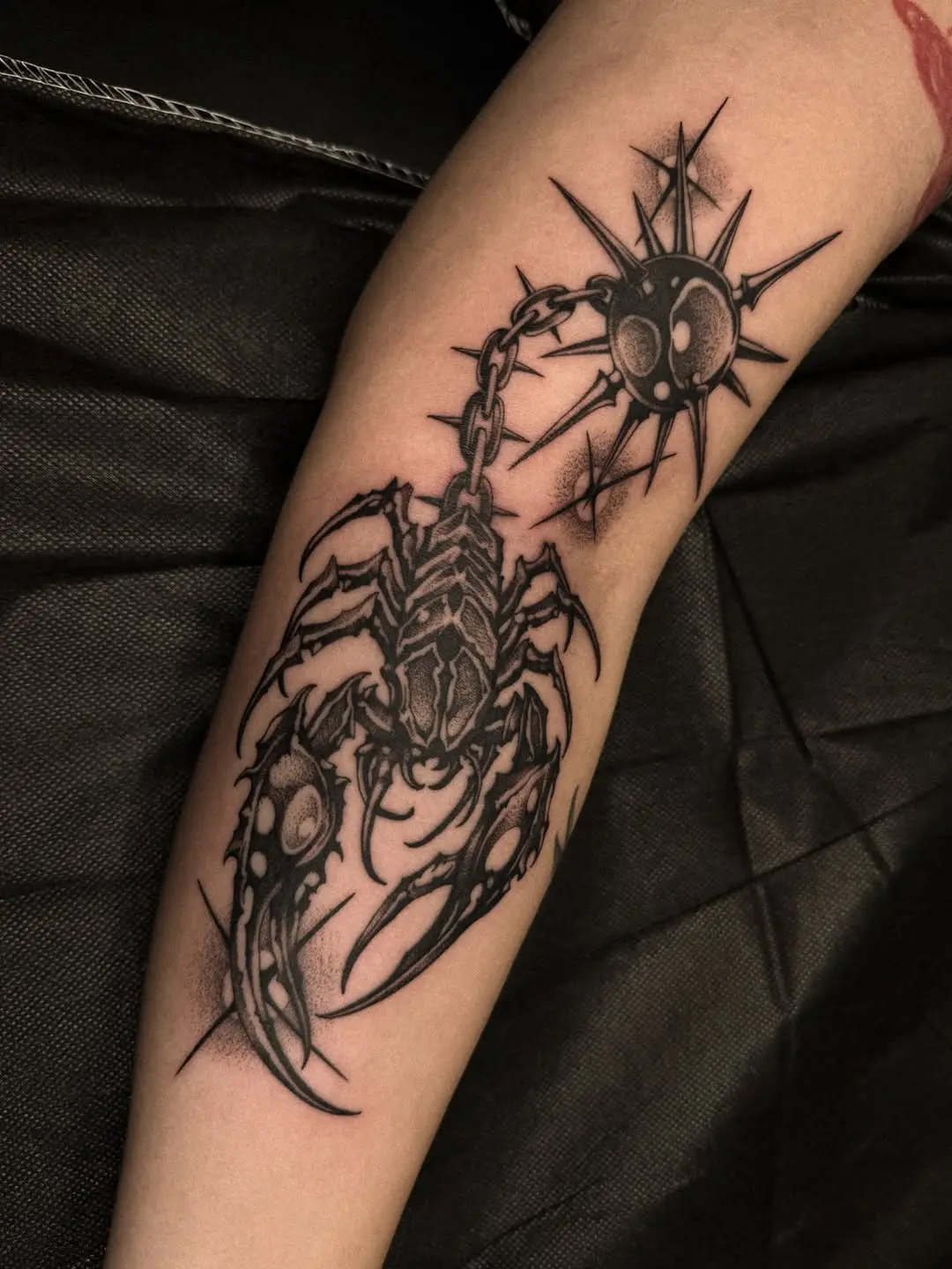 Intricate scorpion with chain design