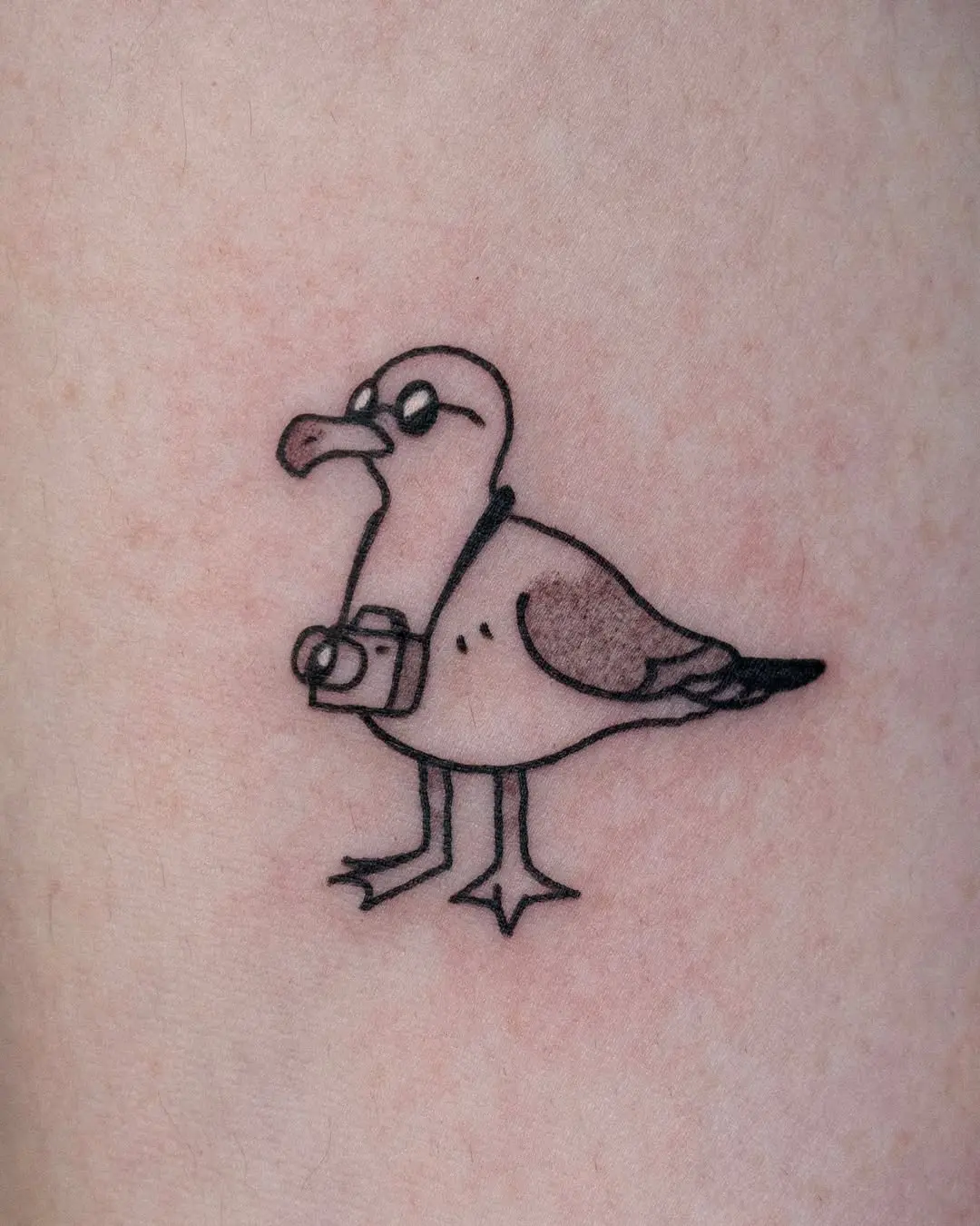 Humorous Seagull Tattoo with Camera Design