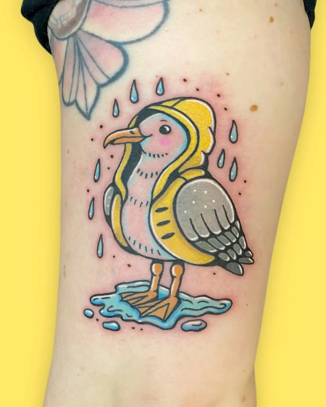 Adorable seagull in a raincoat tattoo design