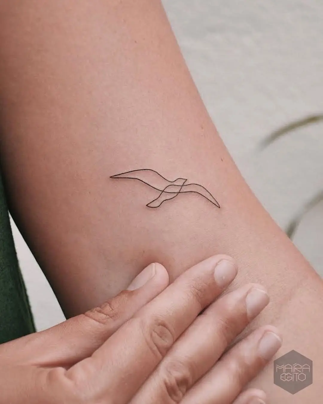 Elegant minimalist seagull tattoo design
