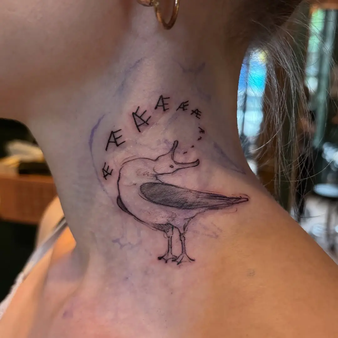 Elegant seagull tattoo on the neck