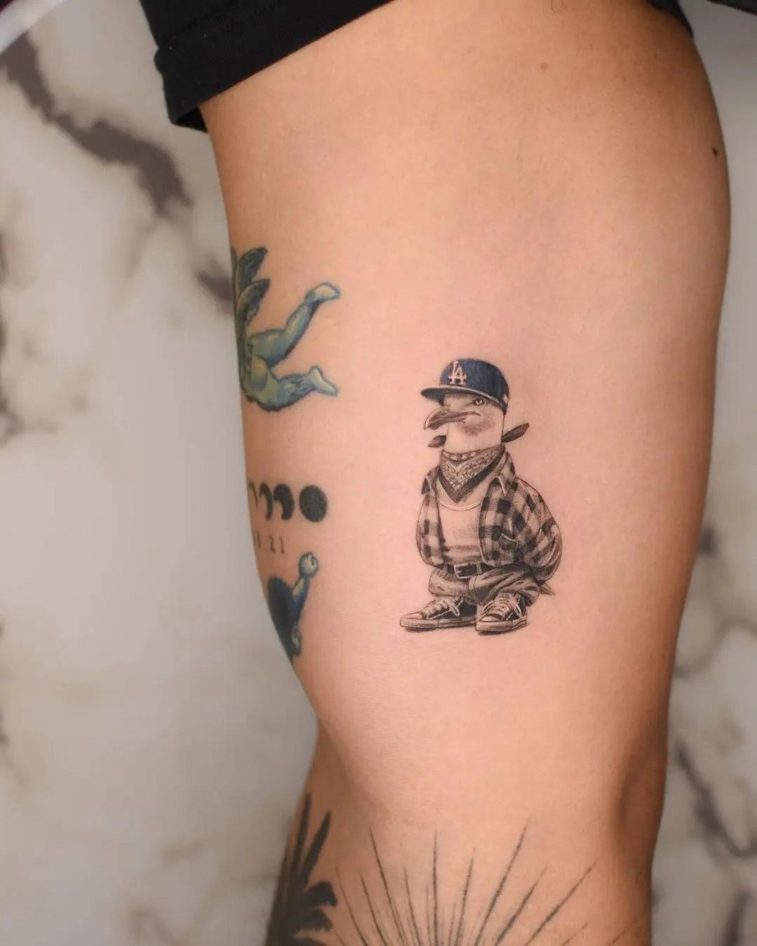 Unique seagull tattoo with urban flair