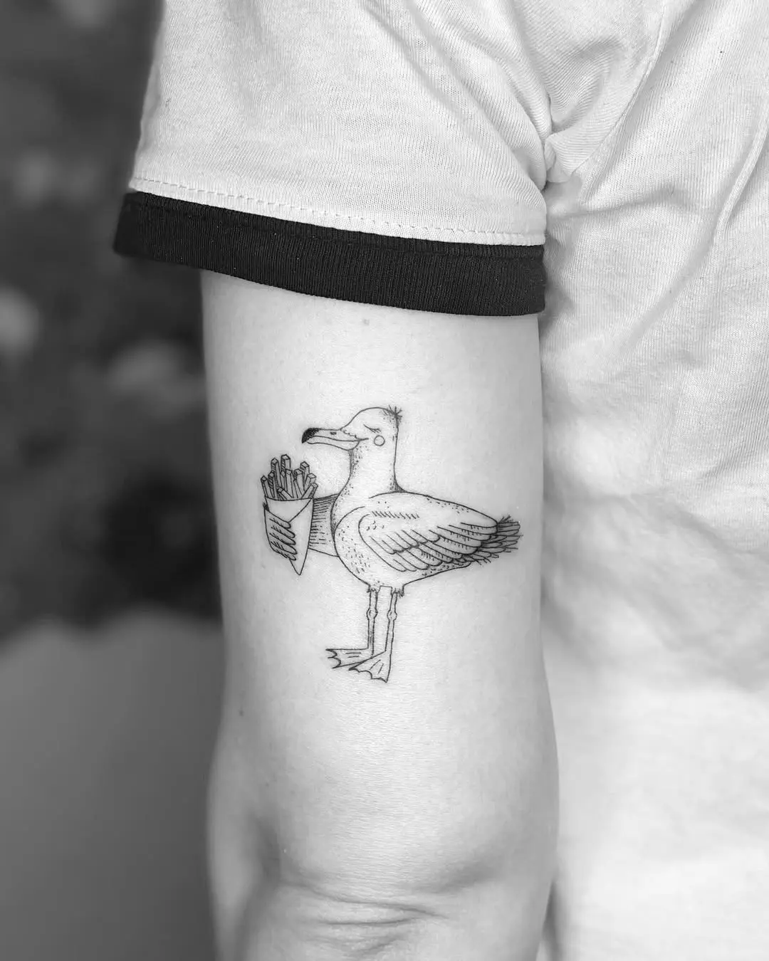 Unique seagull tattoo with playful design