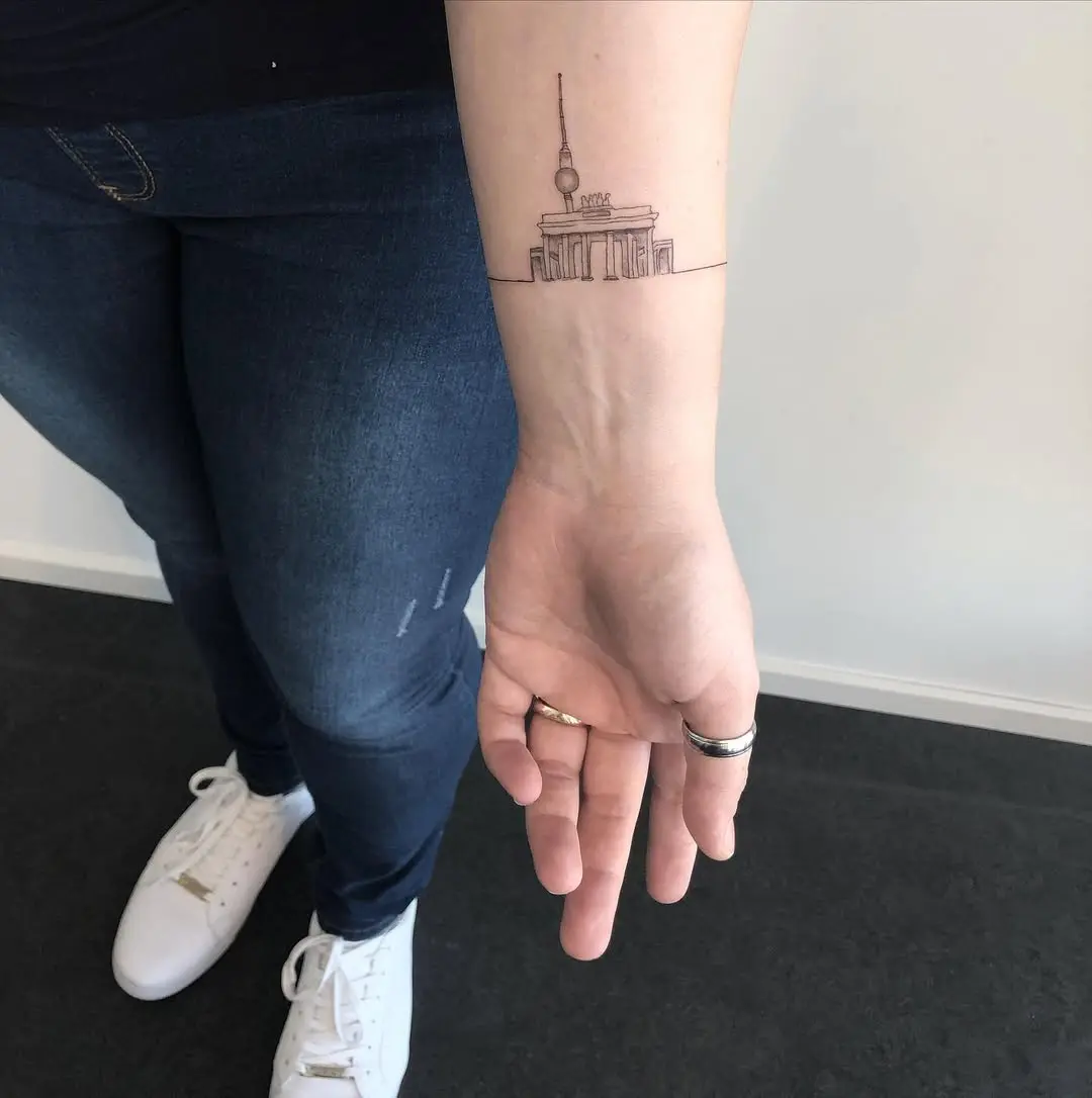 Delicate skyline tattoo featuring an iconic landmark