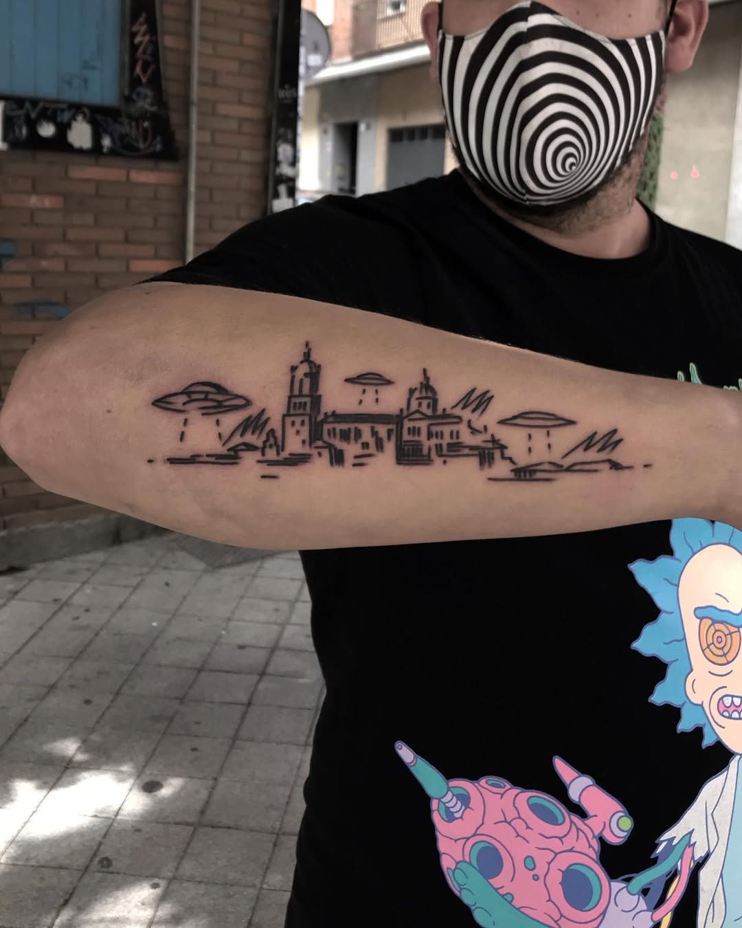 Unique urban skyline tattoo on forearm