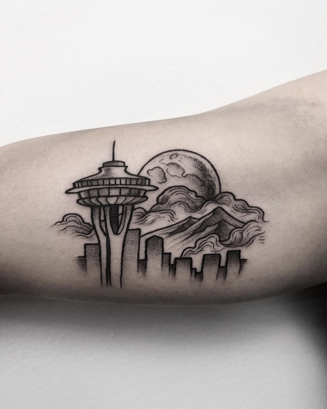 Stunning skyline tattoo featuring Seattle's landmarks