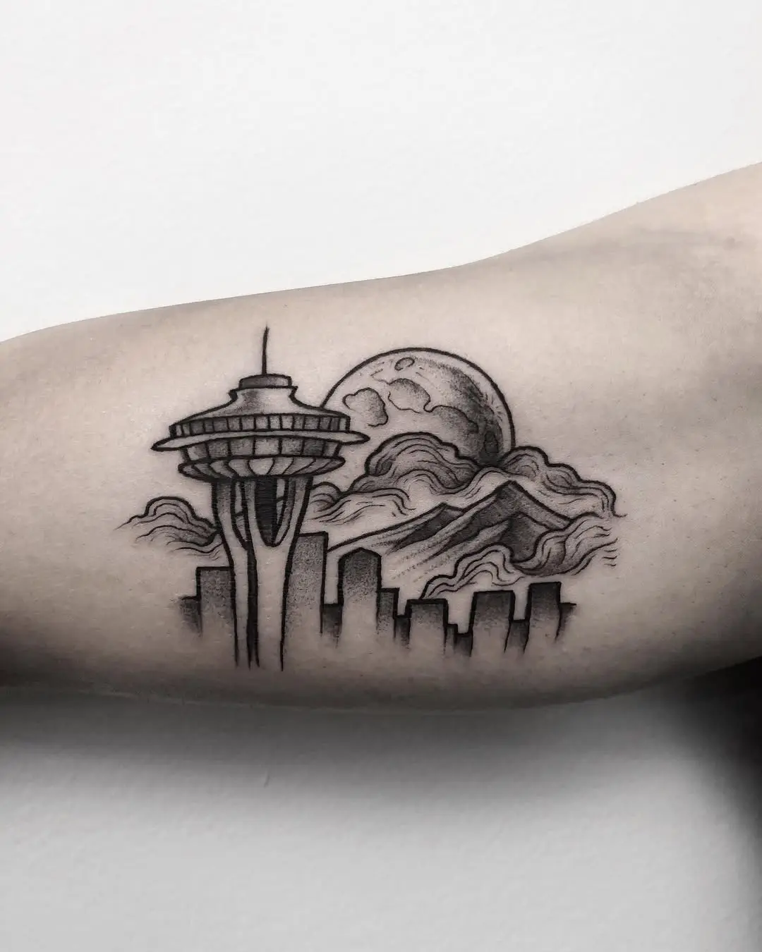 Stunning skyline tattoo featuring Seattle's landmarks
