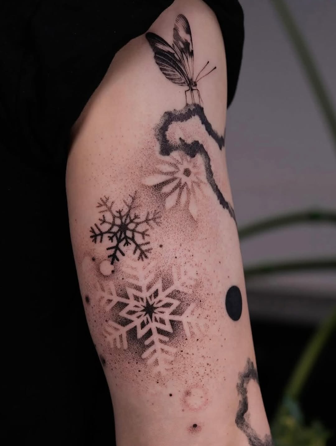 Elegant snowflake tattoo with delicate details