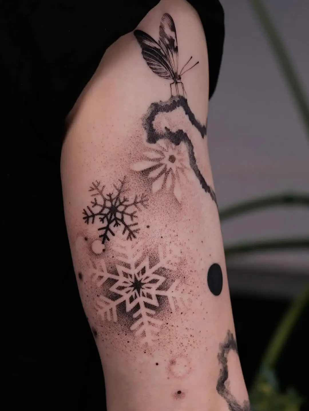 Elegant snowflake tattoo with delicate details