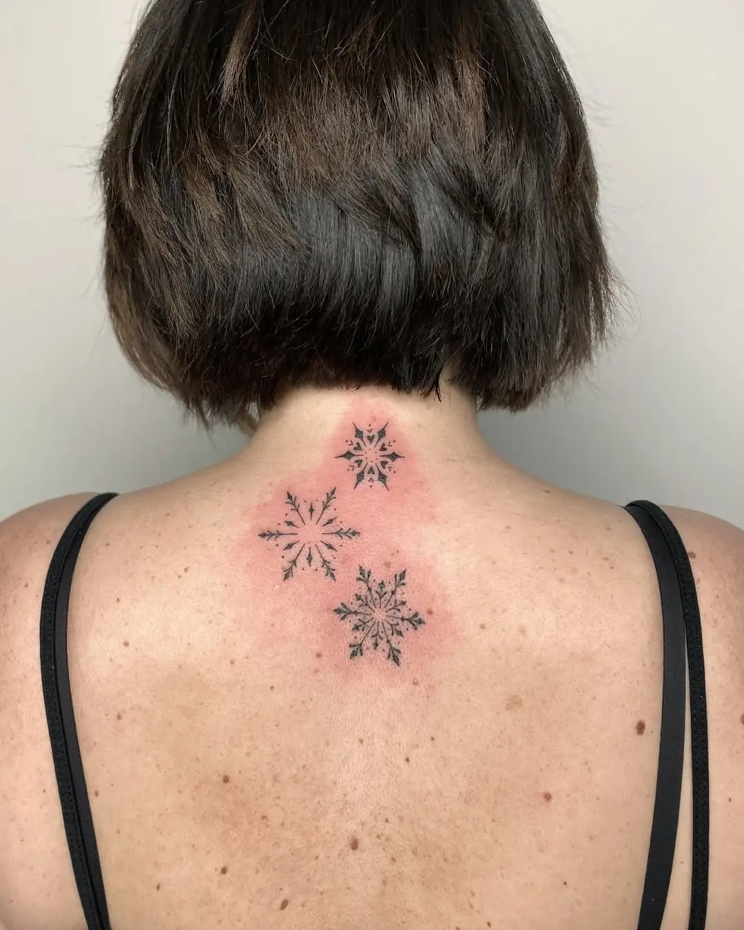 Elegant snowflakes inked on the back