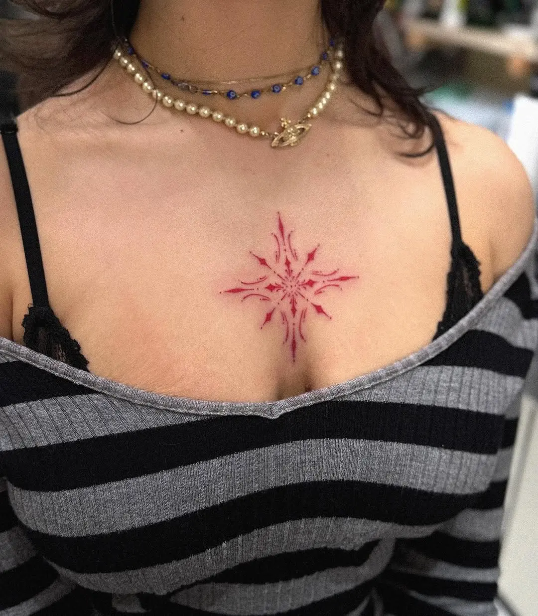 Unique Red Snowflake Tattoo on Chest