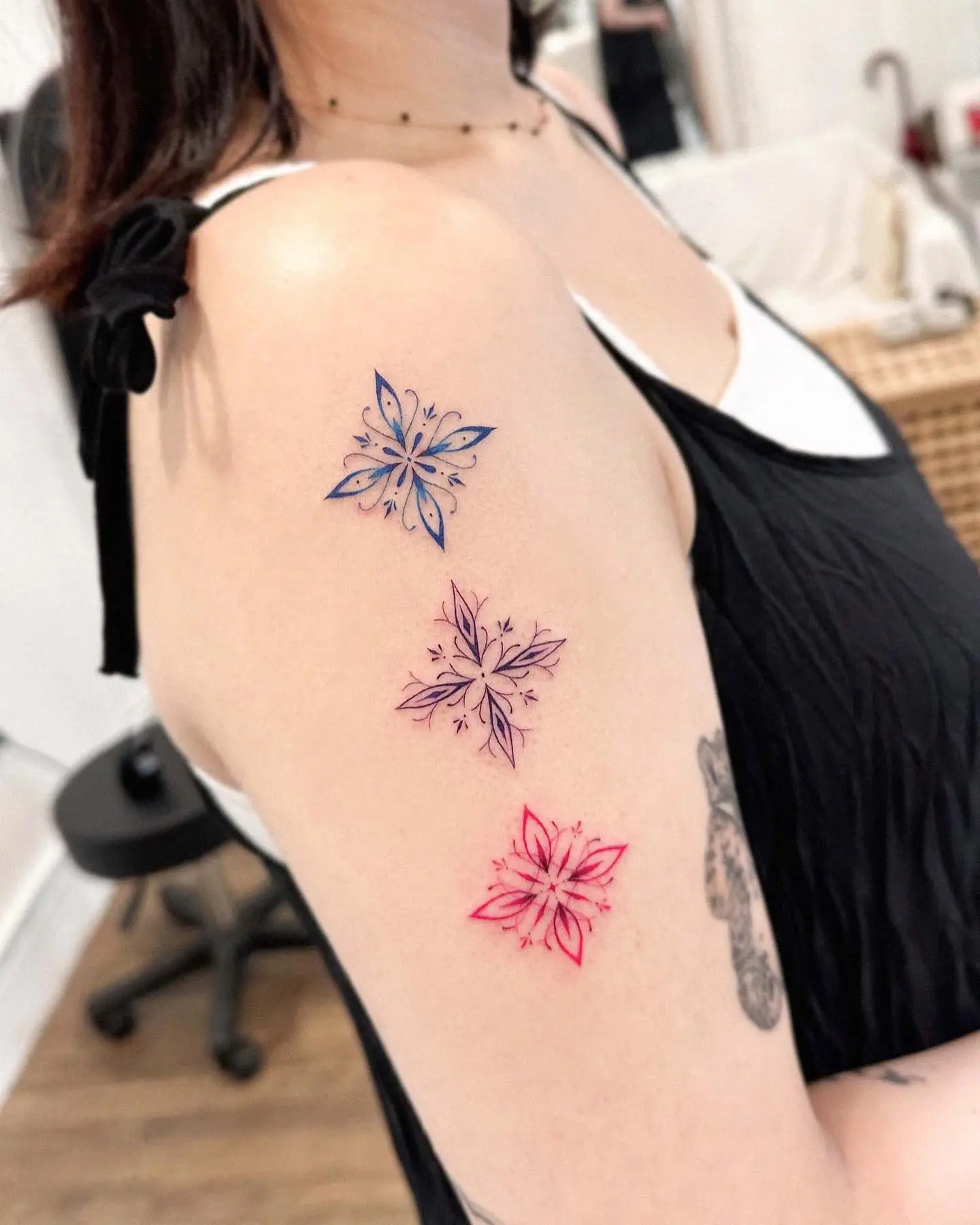 Colorful snowflake tattoos with artistic flair