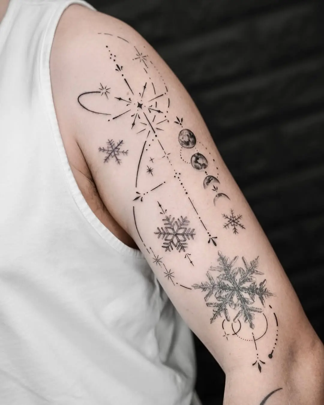 Elegant snowflake tattoo with celestial elements
