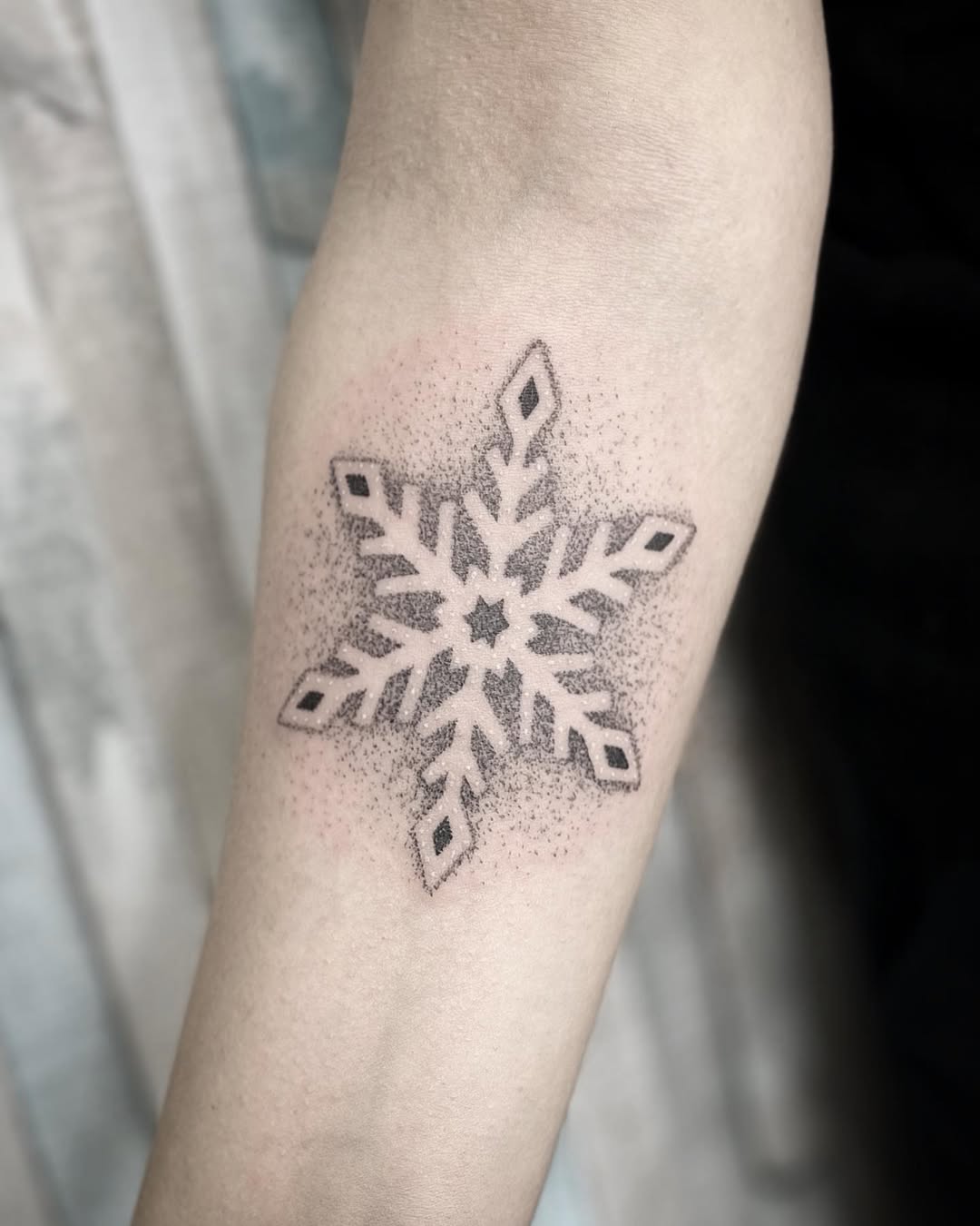 Unique minimalistic snowflake tattoo design pattern