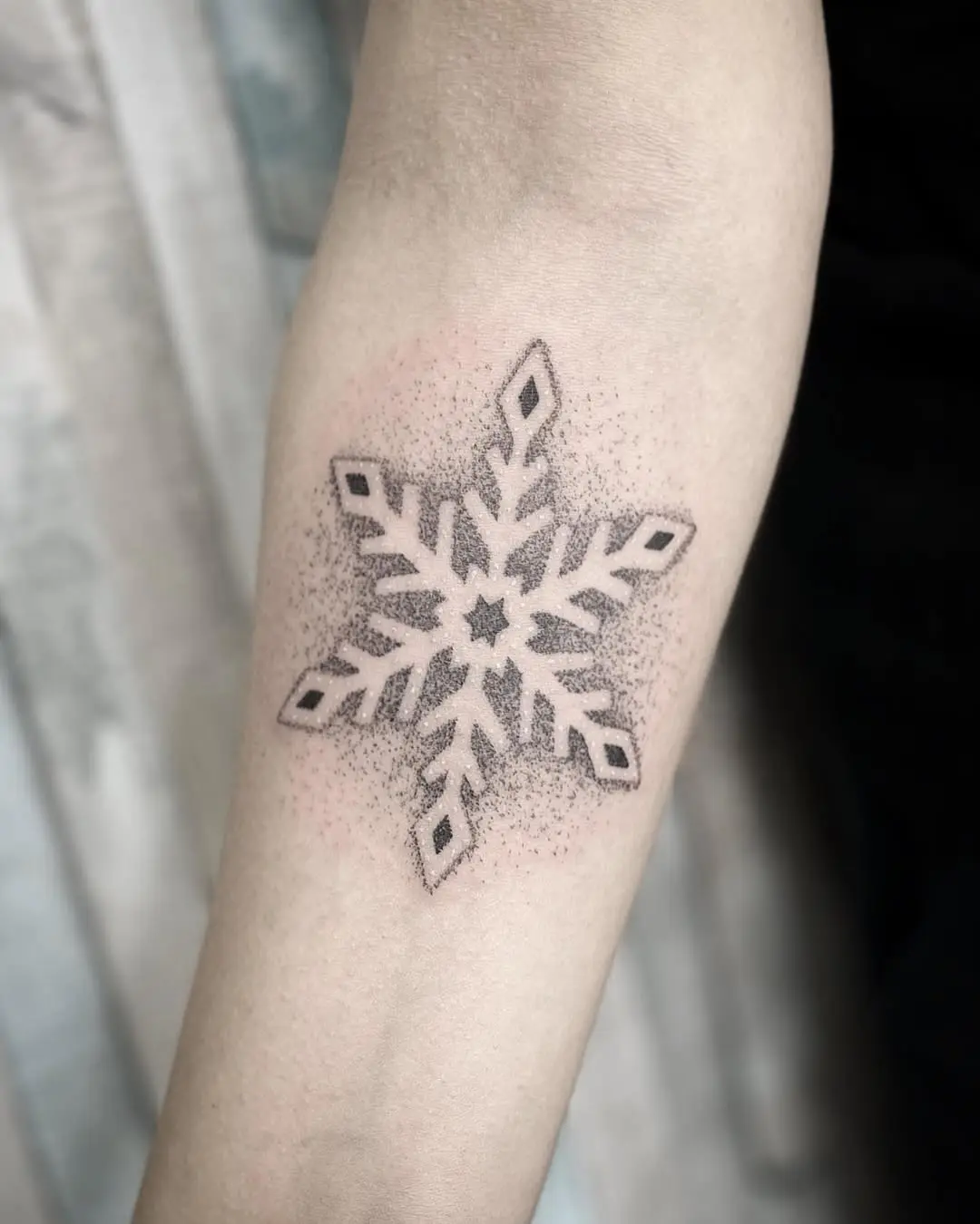 Unique minimalistic snowflake tattoo design pattern