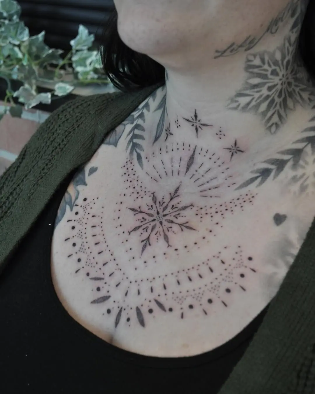 Intricate snowflake tattoo with delicate patterns