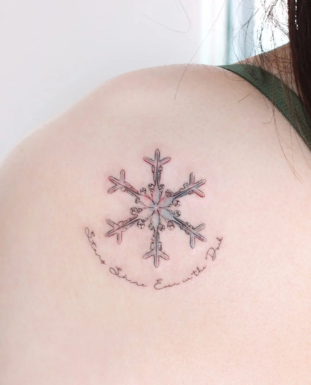 Elegant snowflake tattoo with delicate detailing