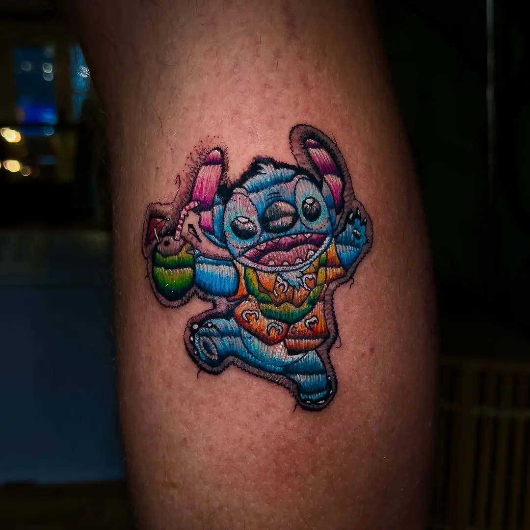 Colorful embroidery-style character tattoo design