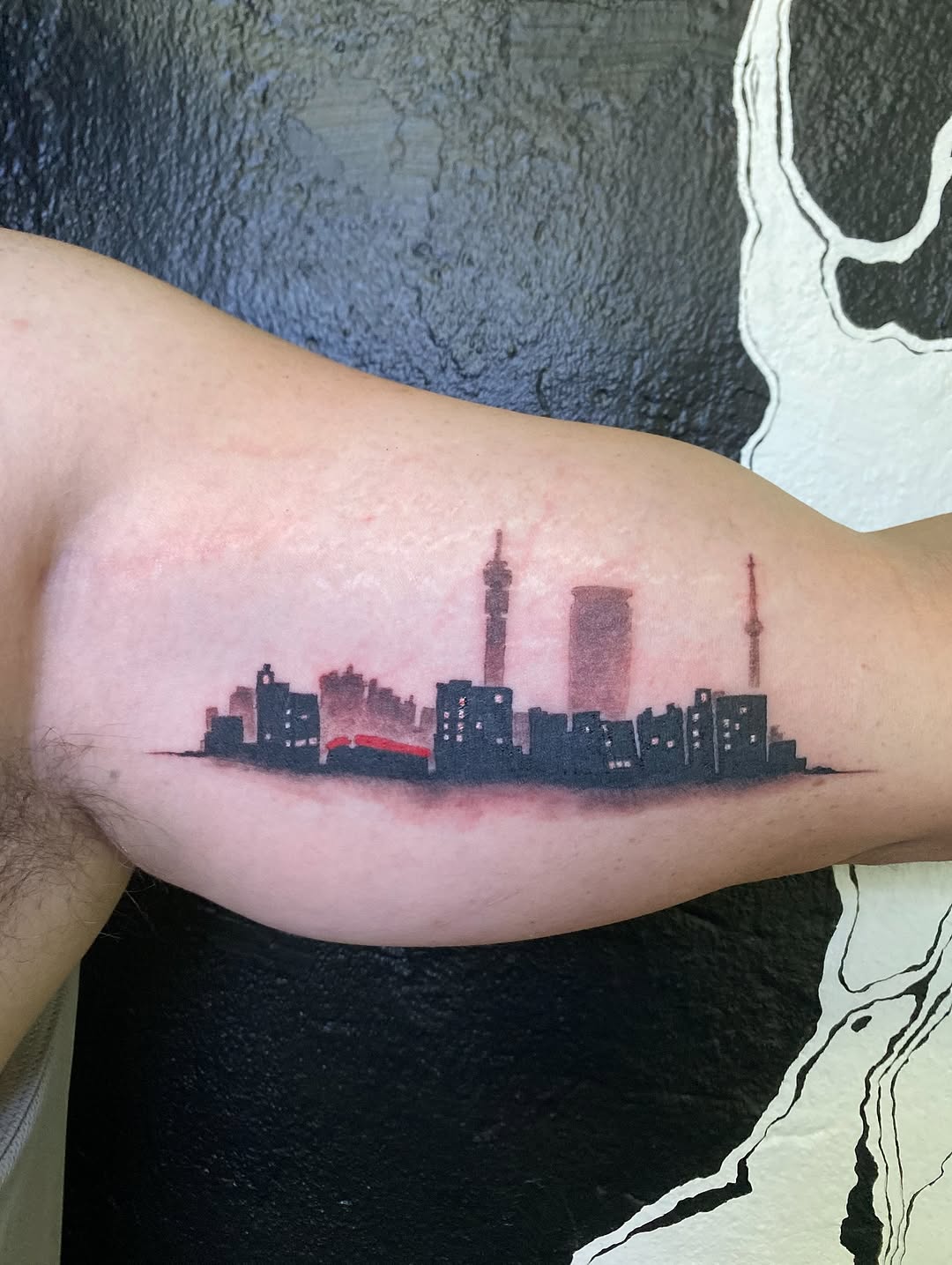 A striking skyline tattoo with vibrant hues
