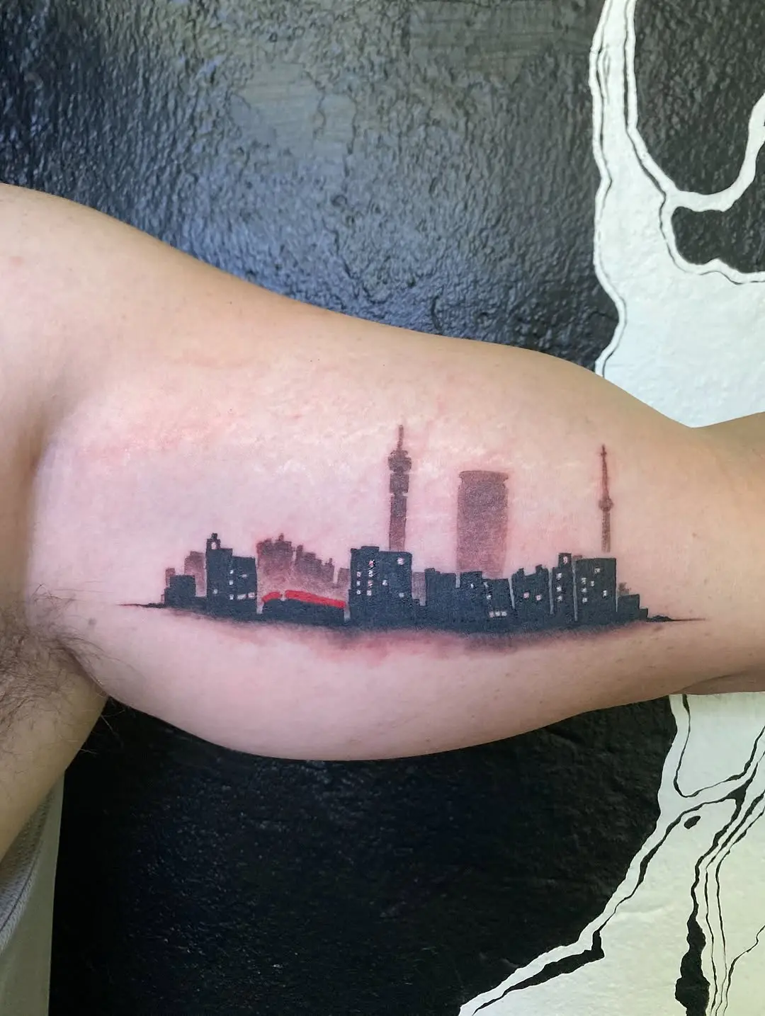 A striking skyline tattoo with vibrant hues