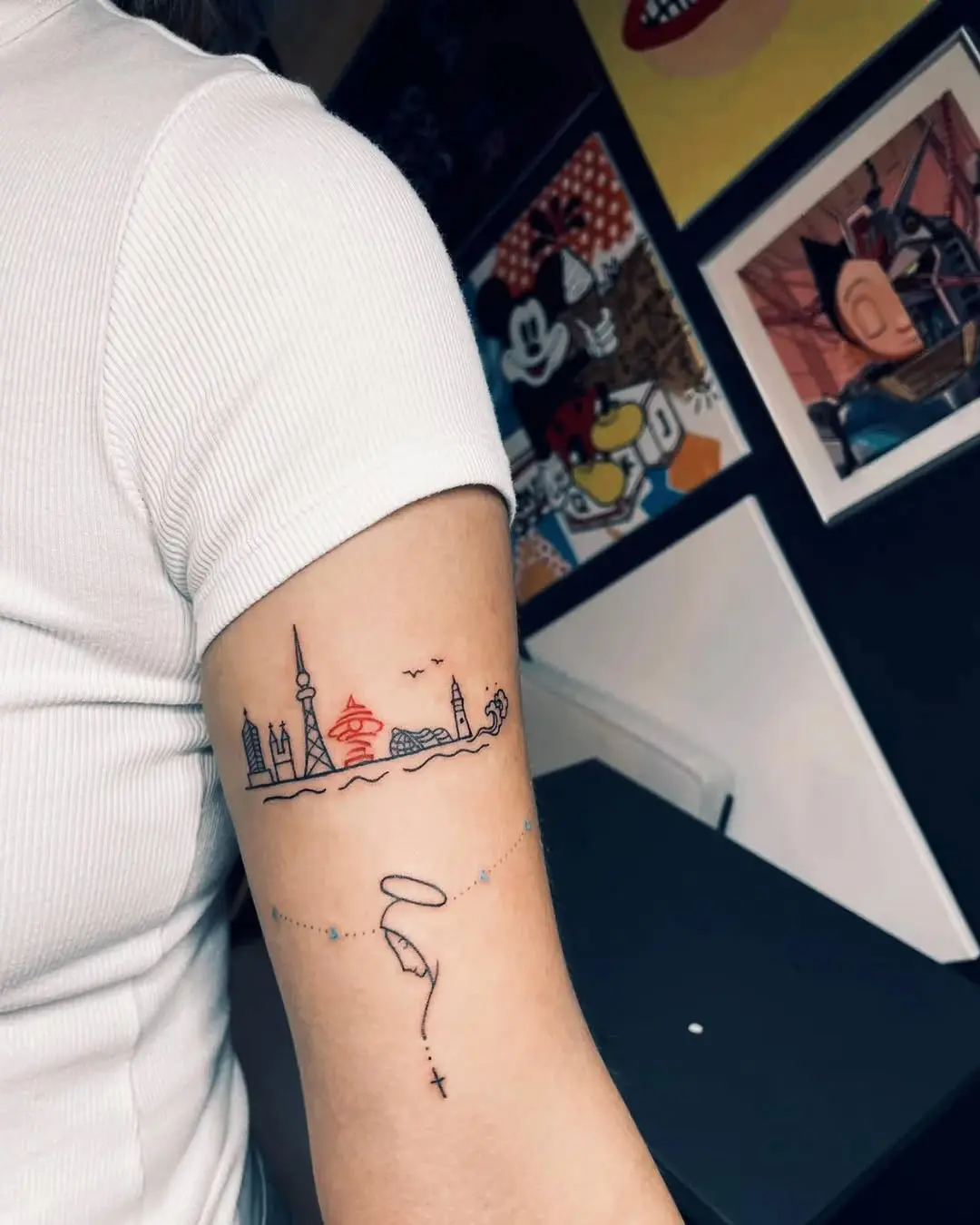 Artistic skyline tattoo with vibrant elements