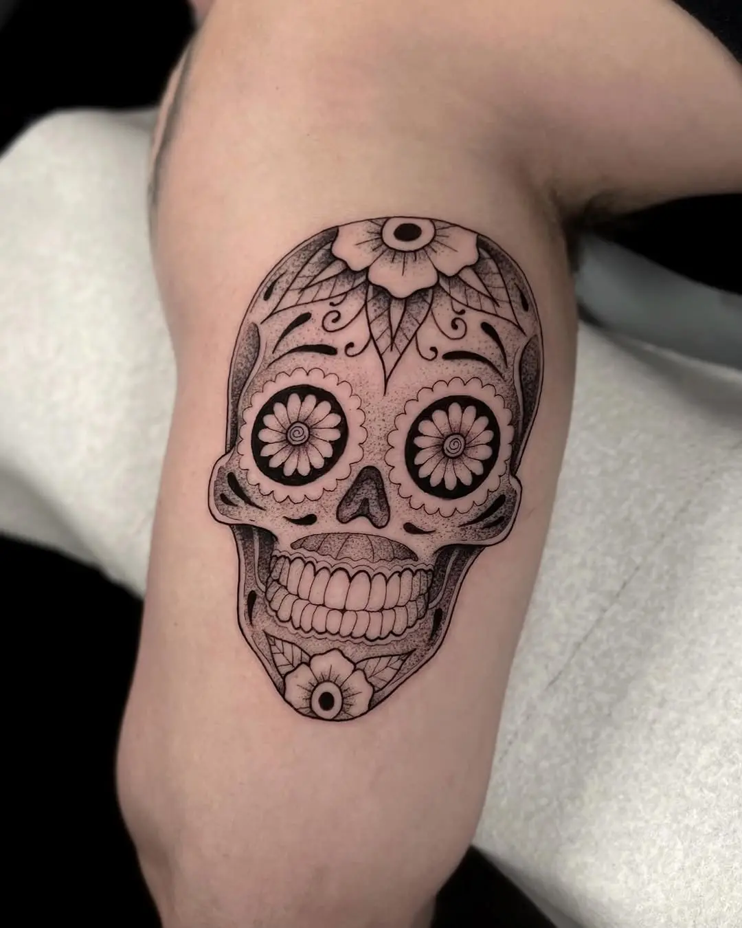 Intricate Sugar Skull Tattoo with Floral Details
