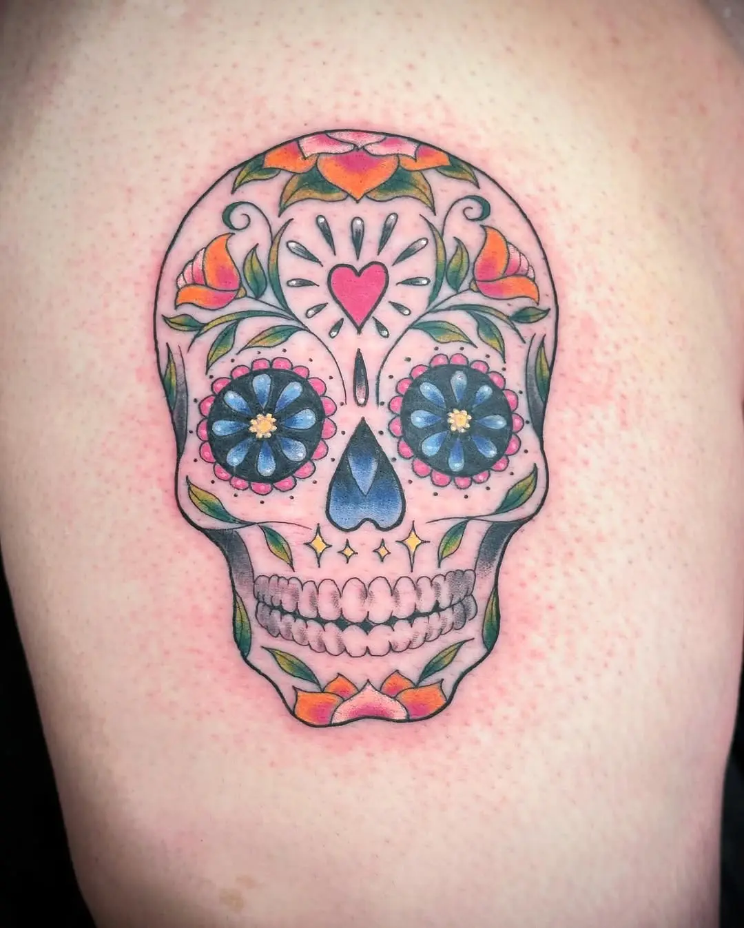 Vibrant Sugar Skull Tattoo with Floral Details