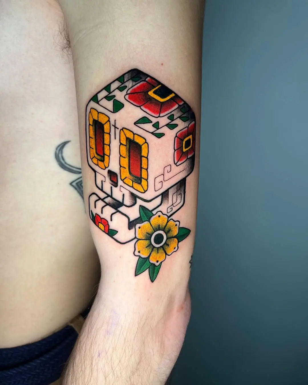 Vibrant sugar skull tattoo with floral accents