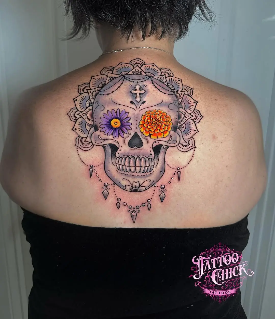 Vibrant Sugar Skull Tattoo with Floral Accents