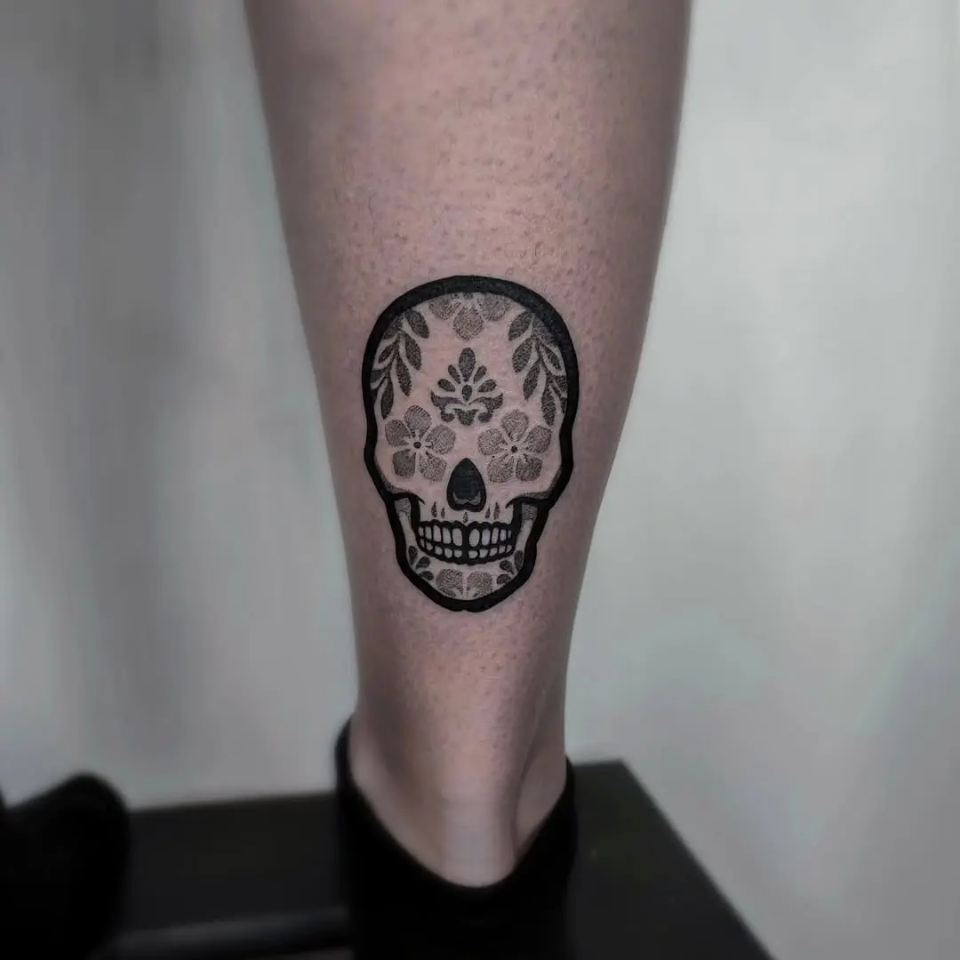 Elegant Sugar Skull Tattoo with Floral Elements