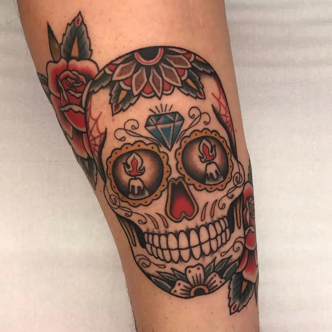 Vibrant sugar skull tattoo with floral elements