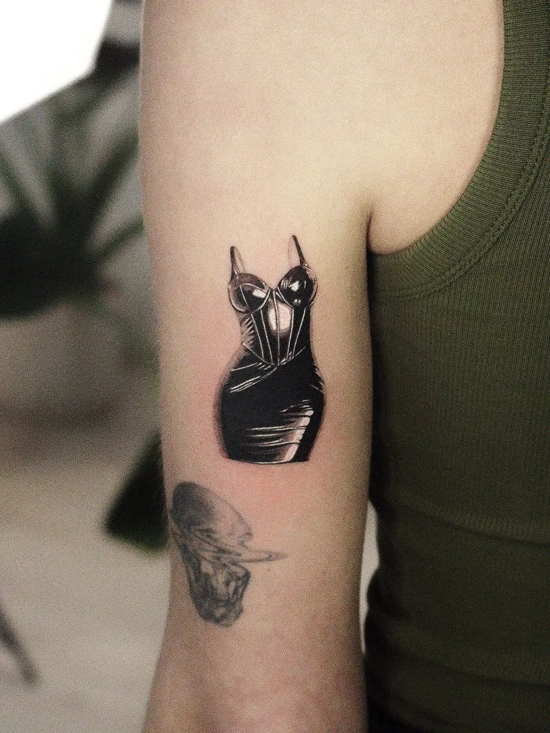 Elegant dotwork dress tattoo design on arm