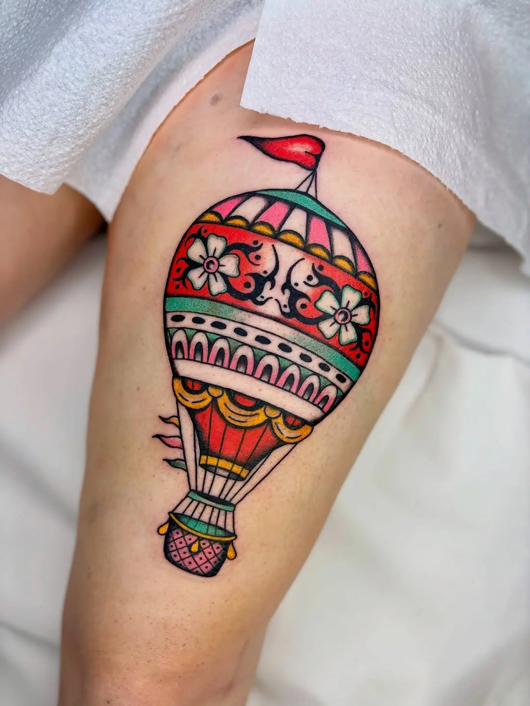 A vibrant hot air balloon tattoo design