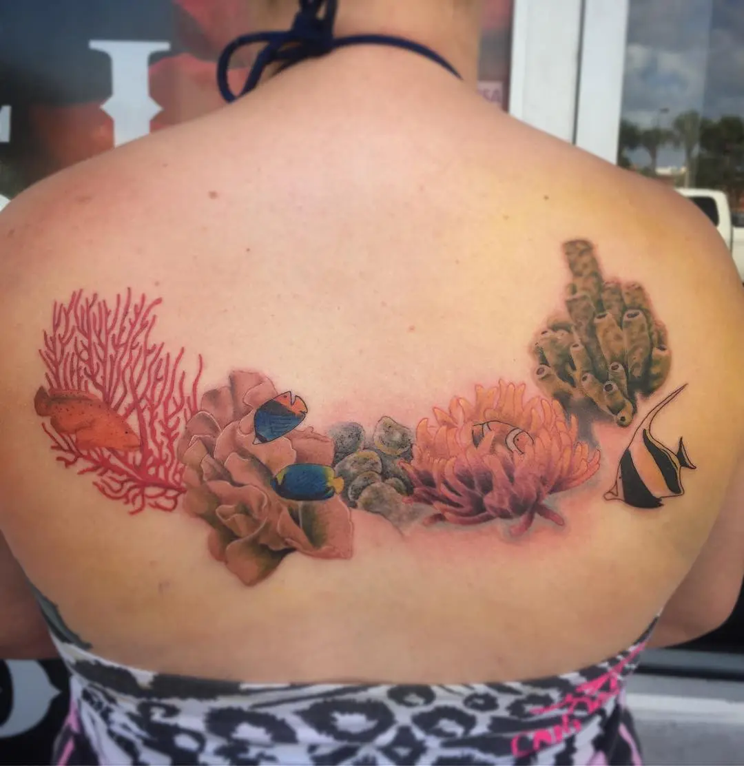 Colorful coral reef tattoo on the back