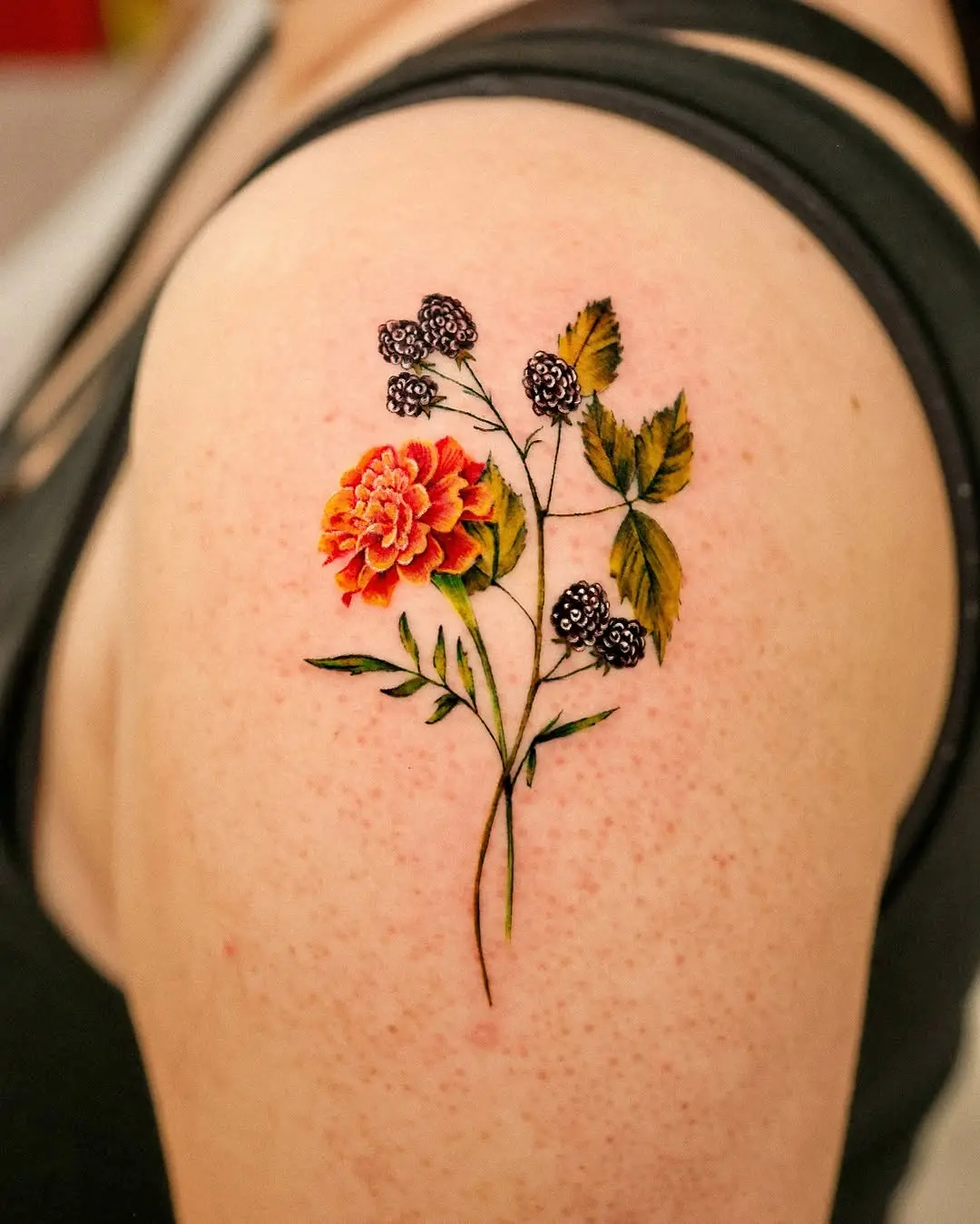 Radiant marigold tattoo showcasing vibrant colors