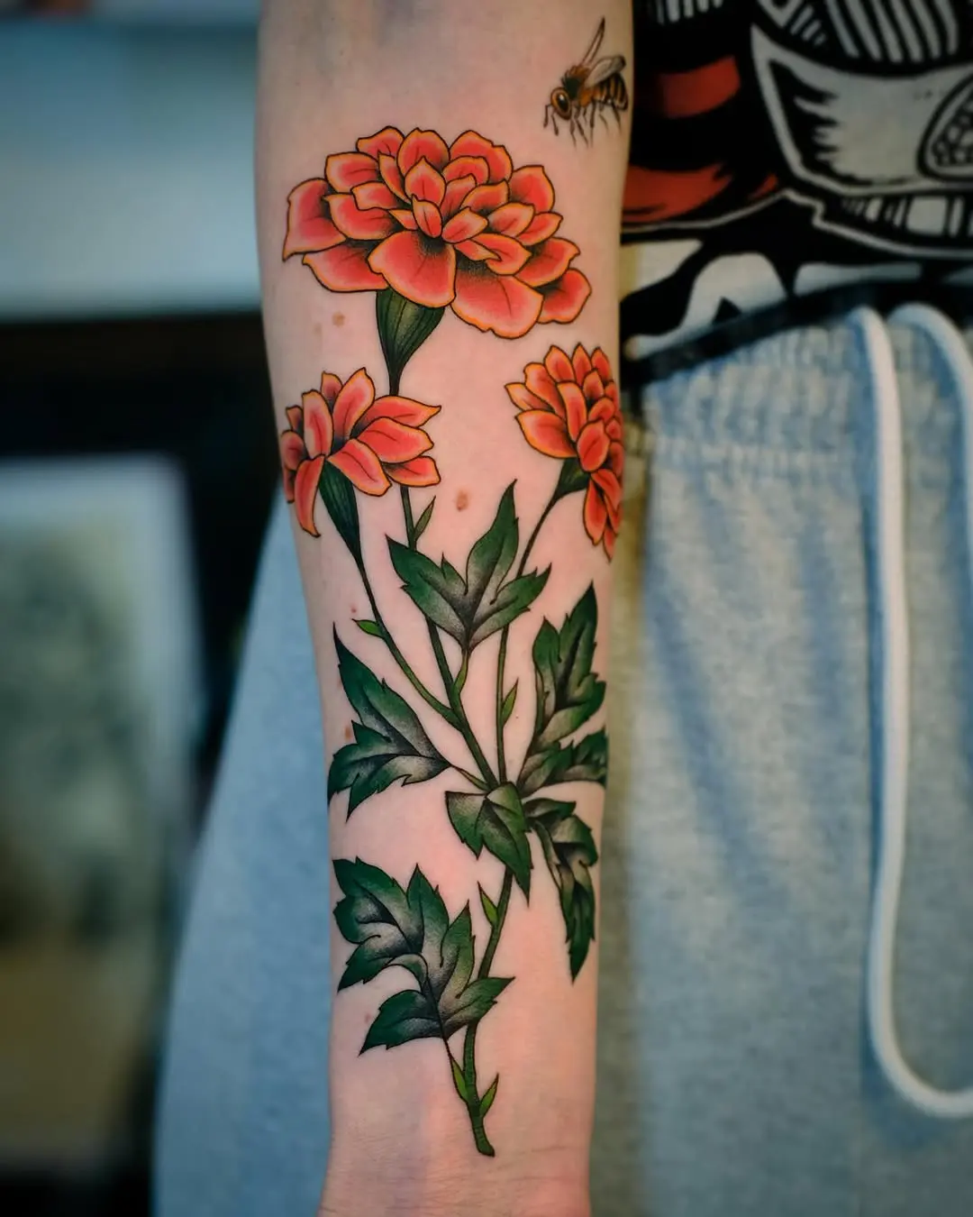 Beautiful marigold tattoos with vibrant colors
