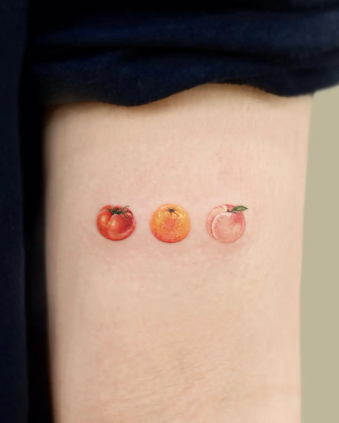 Colorful peach tattoo trio design beauty