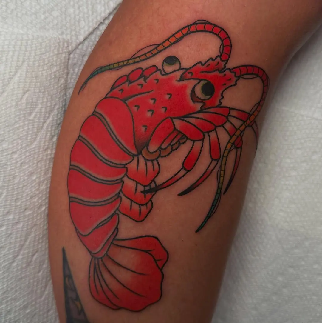 Vivid lobster tattoo with bold colors and details